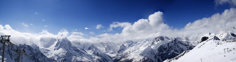 Panoramic view on ski slope in nice sun day