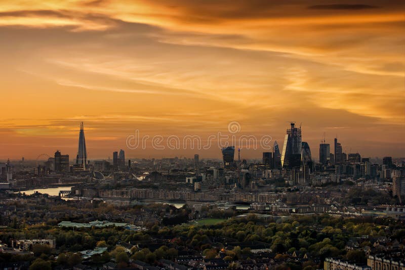 Panoramic view of the skyline of London during sunset: from the City to the Tower Bridge along the Thames river