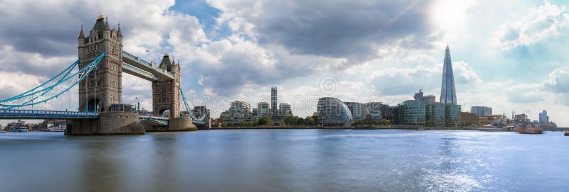 Panoramic view of the skyline of London: from Tower Bridge to London Bridge on a sunny summer day. Panoramic view of the skyline of London: from Tower Bridge to London Bridge on a sunny summer day