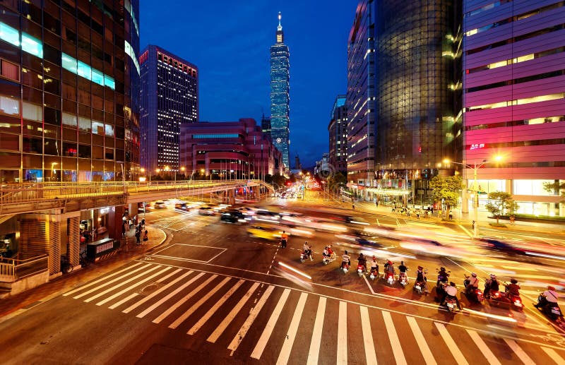 Panoramic view of a street corner in Downtown Taipei City with busy traffic trails at rush hour stock image Panoramic view of a street corner in Downtown Taipei City with busy traffic trails at rush hour stock image