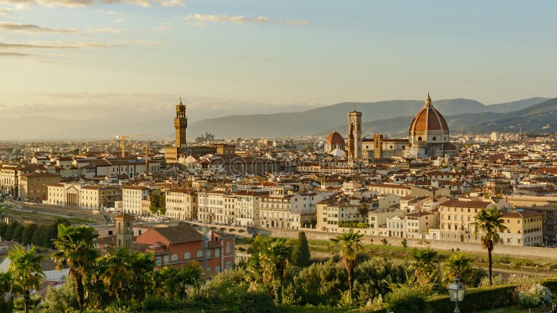 Panoramic view of sunset over florence italy. Sunset over florence italy from piazzale michelangelo view with river arno trees brunelleschi dome palazzo vecchio stock photo Panoramic view of sunset over florence italy. Sunset over florence italy from piazzale michelangelo view with river arno trees brunelleschi dome palazzo vecchio stock photo