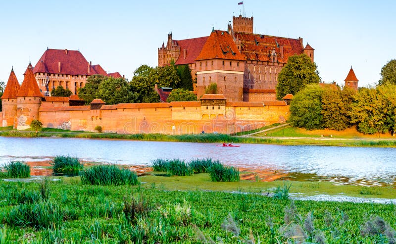 Panoramic view of the Teutonic Order Castle in Malbork during sunset royalty free stock images