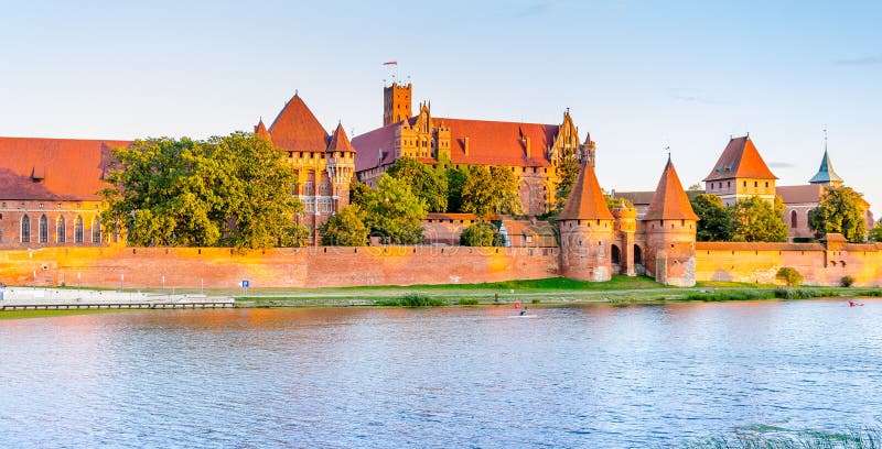 Panoramic view of the Teutonic Order Castle in Malbork during sunset stock photo