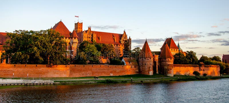 Panoramic view of the Teutonic Order Castle in Malbork during sunset royalty free stock photo