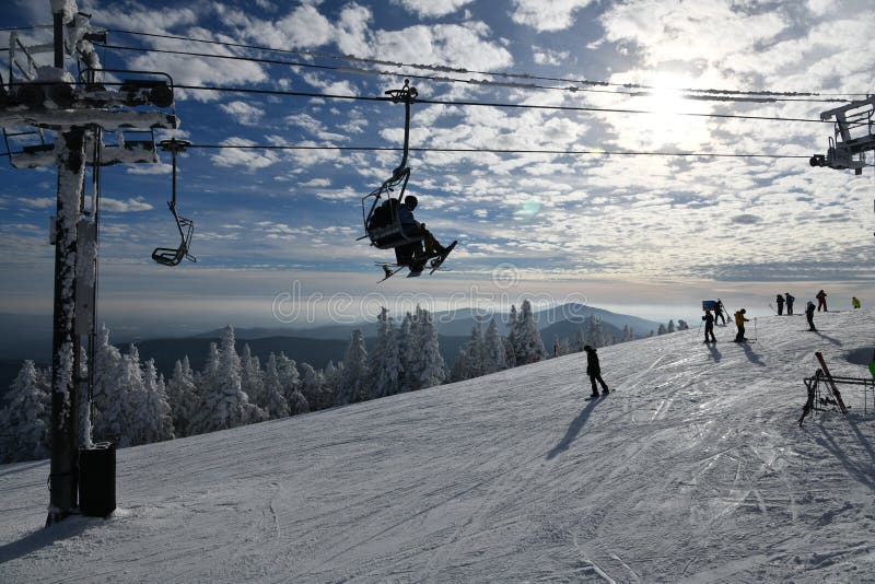 Panoramic view to the ski slopes with fresh snow from the Octagon cafe observation deck at peak Mansfield 4393 ft summit - Stowe Ski resort, VT