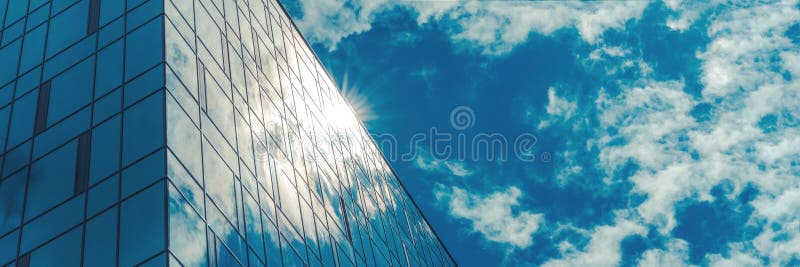 Panoramic windows of local building reflect bright sunlight stock photography