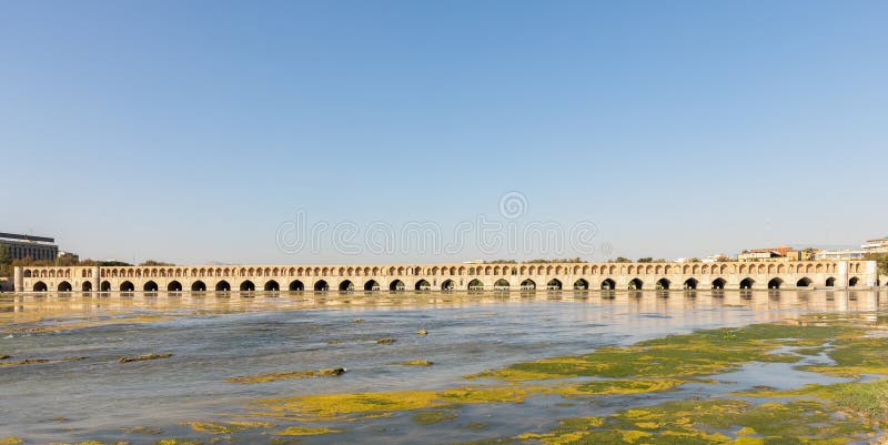 Panoramic view of Si-o-Se Pol (Bridge of 33 Arches or Allahverdi Khan Bridge) and Zayanderud River in Isfahan, Iran. Architectural masterpiece and historical heritage. Tourist attraction. Panoramic view of Si-o-Se Pol (Bridge of 33 Arches or Allahverdi Khan Bridge) and Zayanderud River in Isfahan, Iran. Architectural masterpiece and historical heritage. Tourist attraction.