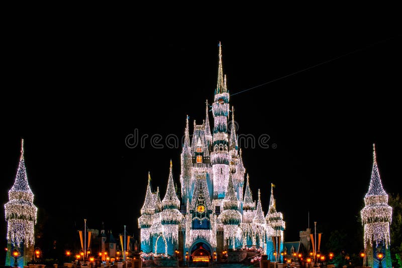 Orlando, Florida. December 05, 2019 . Panoramic view of illuminated Cinderella Castle in Christmas seasons at Magic Kingdom 1. Orlando, Florida. December 05, 2019 . Panoramic view of illuminated Cinderella Castle in Christmas seasons at Magic Kingdom 1.