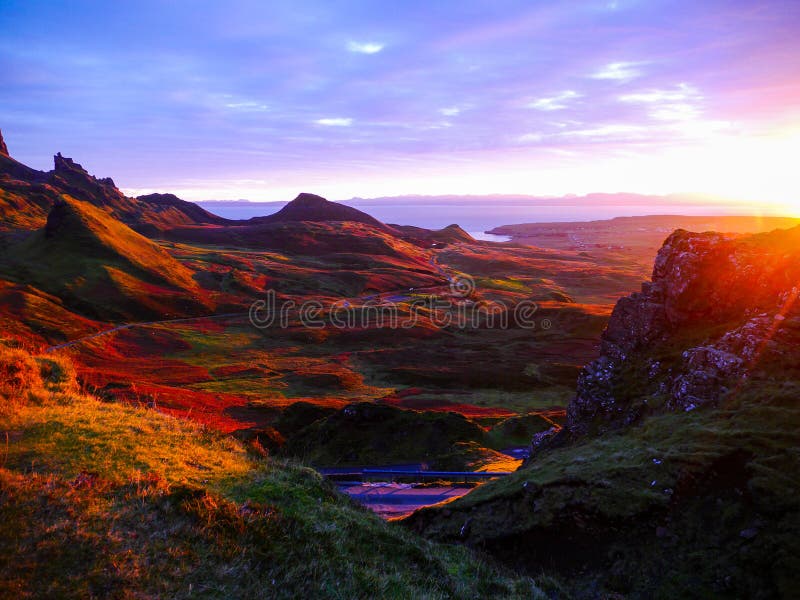 Panoramic view of the ridge of Quiraing at sunrise from the viewpoint in morning light, Scotland. Panoramic view of the ridge of Quiraing at sunrise from the viewpoint in morning light, Scotland