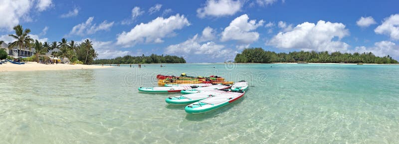 Panoramic landscape view of colorful stand up paddleboarding on Muri lagoon in Rarotonga Island , Cook Islands. Panoramic landscape view of colorful stand up paddleboarding on Muri lagoon in Rarotonga Island , Cook Islands.