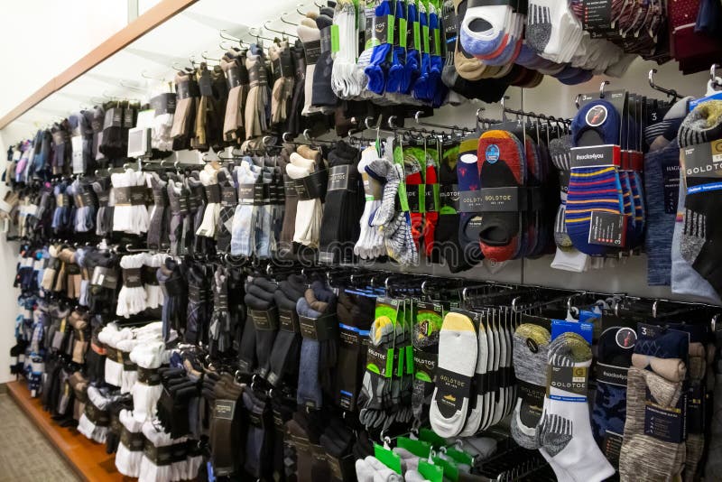 A view of a wall display full of men`s socks, seen at a local clothing department store in Los Angeles, California. A view of a wall display full of men`s socks, seen at a local clothing department store in Los Angeles, California.