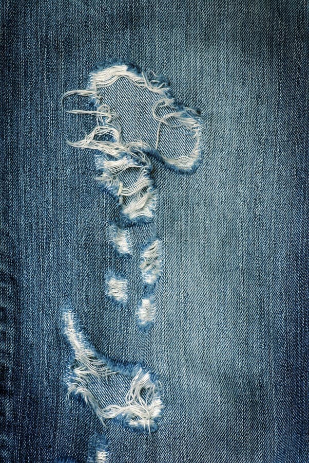 Nice closeup blue jeans texture with holes. Nice closeup blue jeans texture with holes