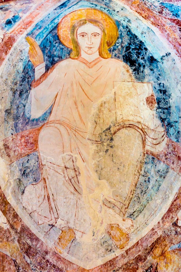Christ pantocrator sitting on the rainbow, a romanesque wall-painting in ultramarine at Asum church, Sweden - May 12, 2014. Christ pantocrator sitting on the rainbow, a romanesque wall-painting in ultramarine at Asum church, Sweden - May 12, 2014