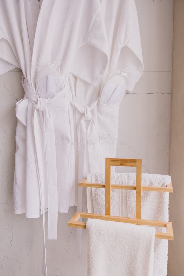 Disposable robes, slippers and a towel. Kit for visiting the spa salon. Hotel items for guests. Luxury interior. Beauty center. Disposable robes, slippers and a towel. Kit for visiting the spa salon. Hotel items for guests. Luxury interior. Beauty center