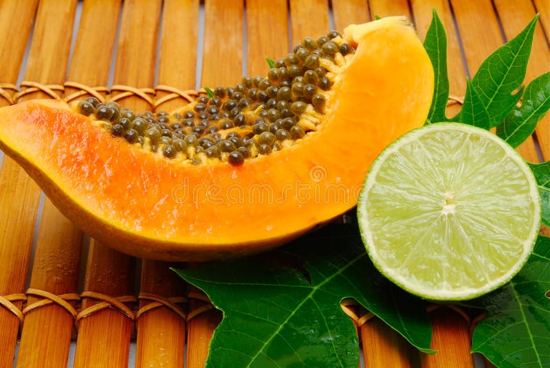 Papaya and lime on bamboo