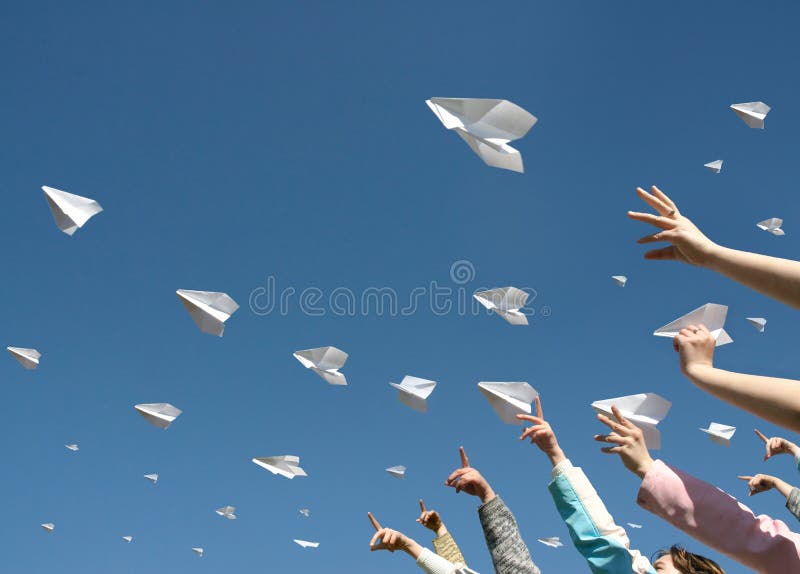 The hands of children throw upwards messages in the manner of paper airplanes.