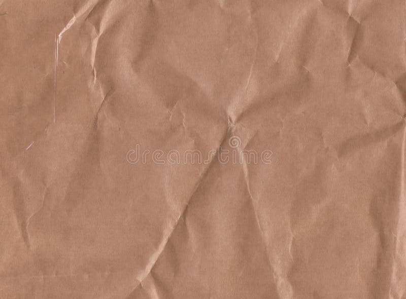 Crumpled kraft paper brown background texture. Recycle brown paper crumpled  texture. Old paper surface for background. Stock Photo