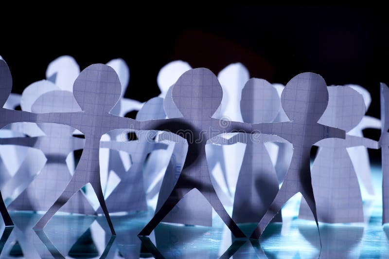 Paper-chain people holding hands royalty free stock image