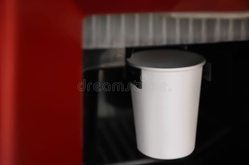 Paper Cup with Coffee in Vending Machine, Closeup Stock Photo Image