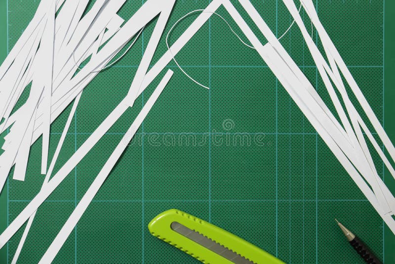 The Paper is Cut with a Cutter. Stock Photo Image of green, silver