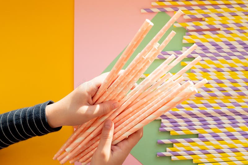 Paper Straws Vs Plastic Straws on Colorful Background.colored Tubules