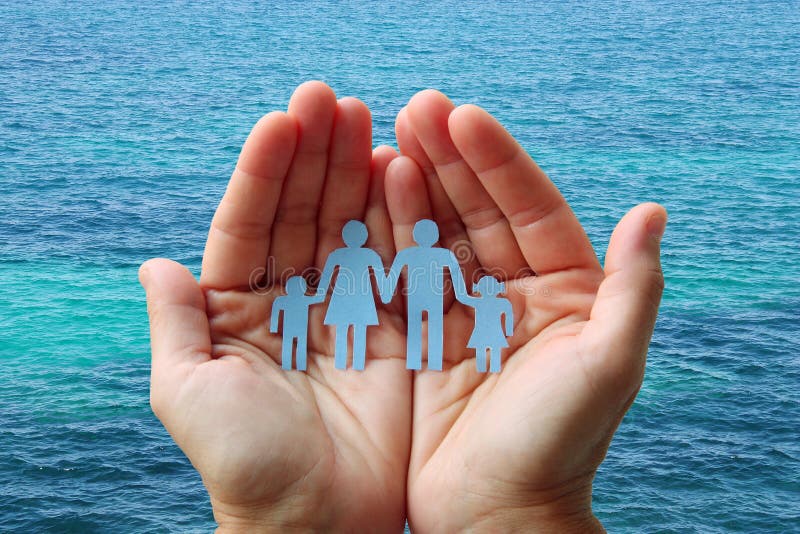 Paper family in hands on blue sea background welfare concept