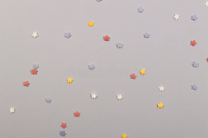 Paper flat composition with stars on the grey background for holiday stock photo