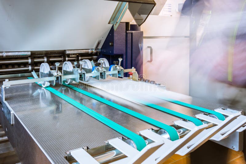 Paper Folding Machine Rollers Conveyor Belt Output Feed Printing stock photo