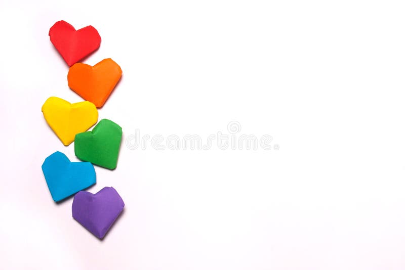 Paper hearts of a rainbow color on a white background. LGBT symbol. Paper hearts of a rainbow color on a white background. LGBT symbol