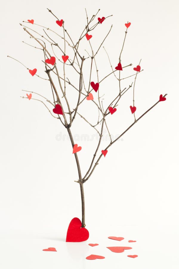 Paper hearts on the tree abstract sign of love