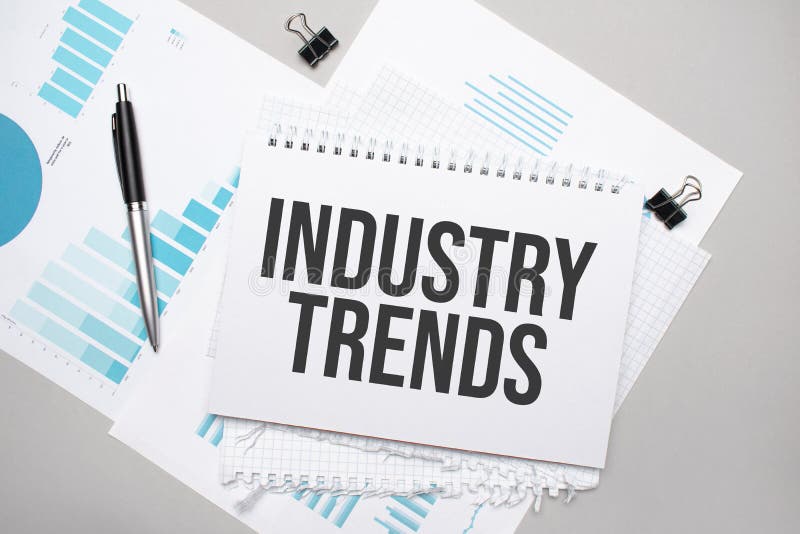 Paper Plate with Text INDUSTRY TRENDS. Diagram, Notepad and Blue