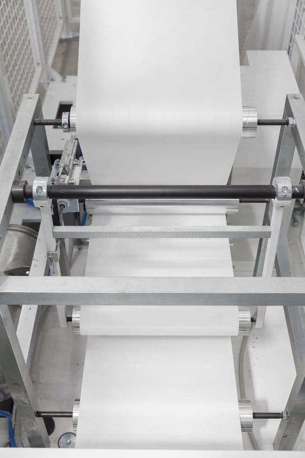 Paper rolling machine stock photo. Image of plastic, woven 91774384