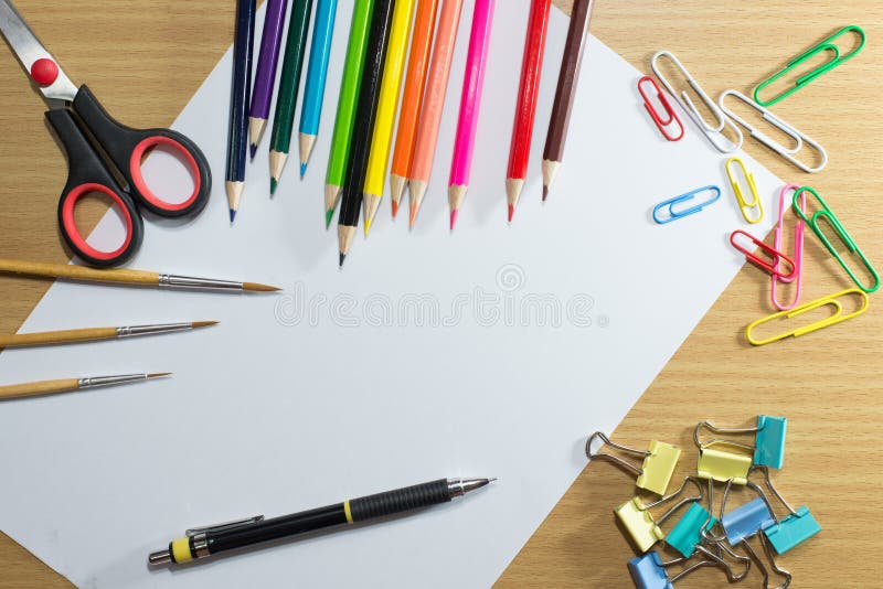 Paper on school and frame of colorful school equipment