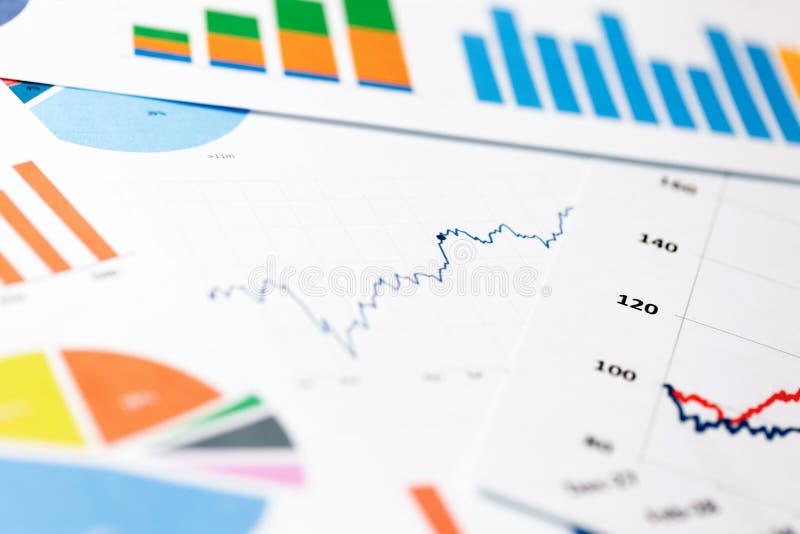 Paper sheets with business graphs and charts
