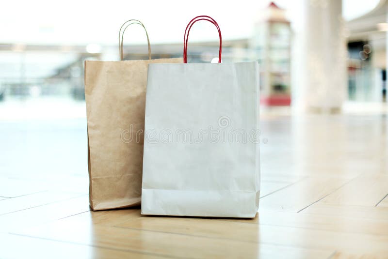 Paper Shopping Bags on Floor at the Mall. Stock Image - Image of ...