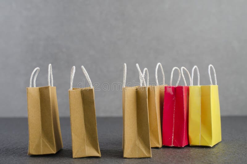 Paper Shopping Bags on Granite Floor and Grey Wall. Stock Photo - Image ...