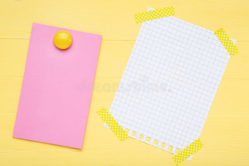 Paper sticky note with white sheet of paper stock photo