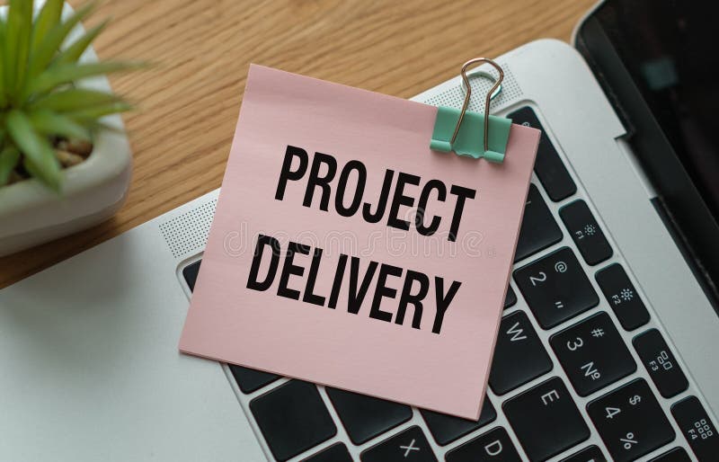 Paper with text Project Delivery on office desk with notepad, Business Concept. Desk business concept stock images, royalty-free photos and pictures