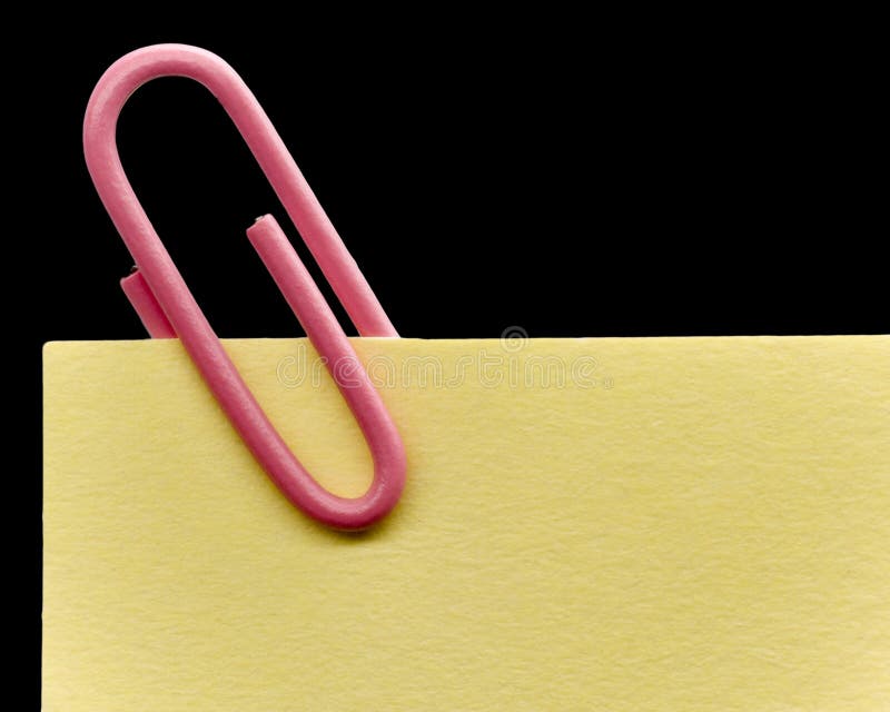 Paperclip on a note royalty free stock photos