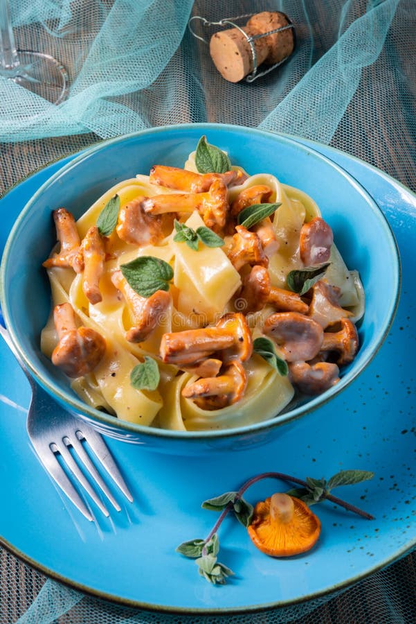 Pappardelle with Cheese Sauce and Fresh Chanterelles Stock Photo