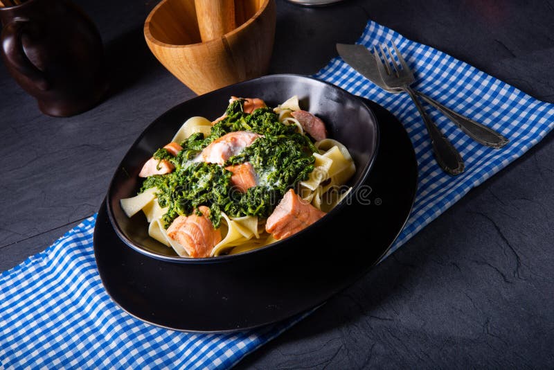 Pappardelle Pasta with Creamed Spinach and Fried Salmon Stock Image