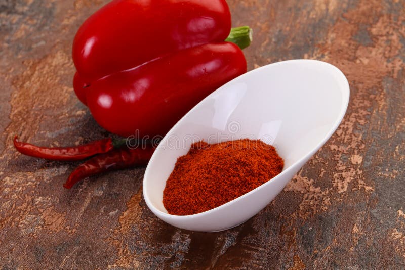 Paprika powder in the bowl stock image. Image of fresh 145789231