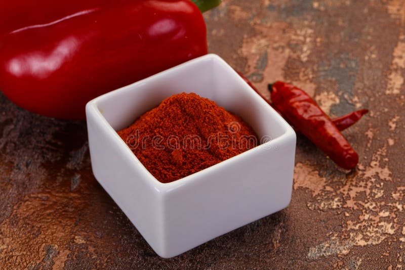 Paprika powder in the bowl stock photo. Image of color 178522292