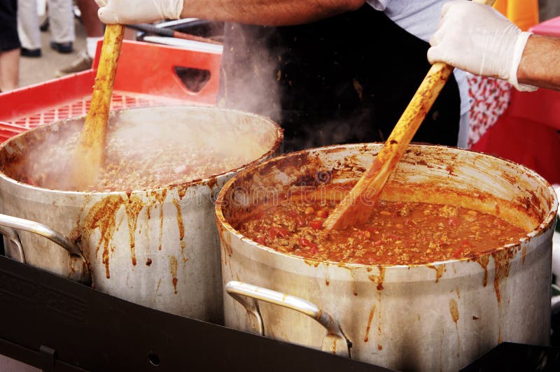 Preparing large batches of chili for a chili cook-off competition. Preparing large batches of chili for a chili cook-off competition.