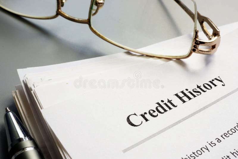 Credit history report papers and glasses. Credit history report papers and glasses