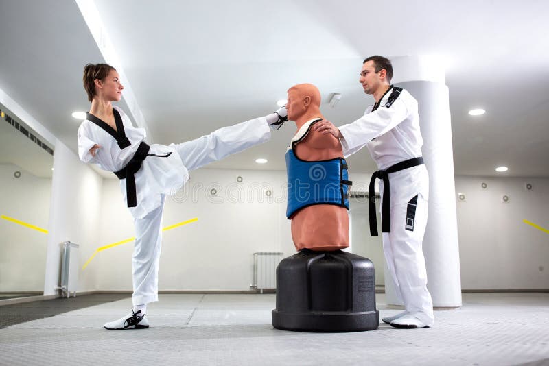 Paraathlete in Martial Arts Doing a Direct Chest Kick Stock Photo
