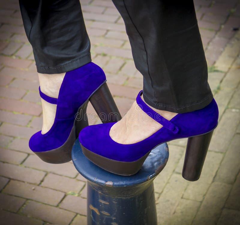 A pair of purple shoes women's heels on the column. A pair of purple shoes women's heels on the column