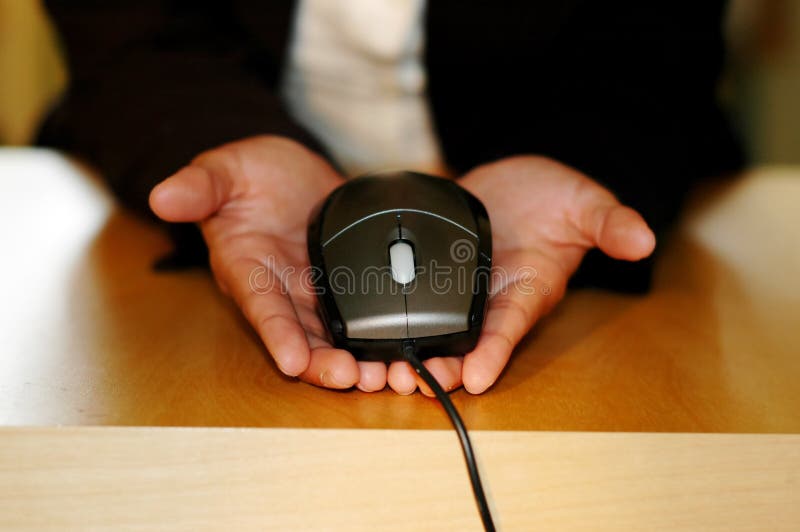 Hand holding the computer mouse. Hand holding the computer mouse