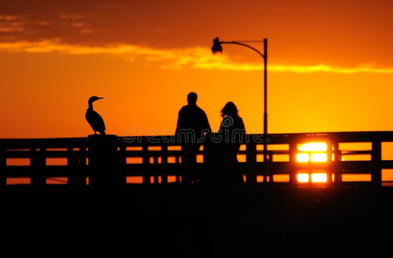 Couple enjoy a beautiful sunset. Couple enjoy a beautiful sunset.