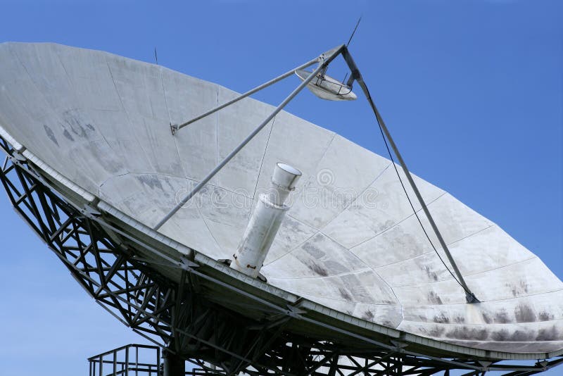 Parabolic satellite dish receiver over blue sky stock images
